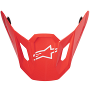 A bright red motocross or off-road peak visor with a white Alpinestars logo in the center, shown against a plain white background.