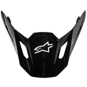 Black Alpinestars motocross helmet visor with a white star logo on the front, shown against a solid white background.