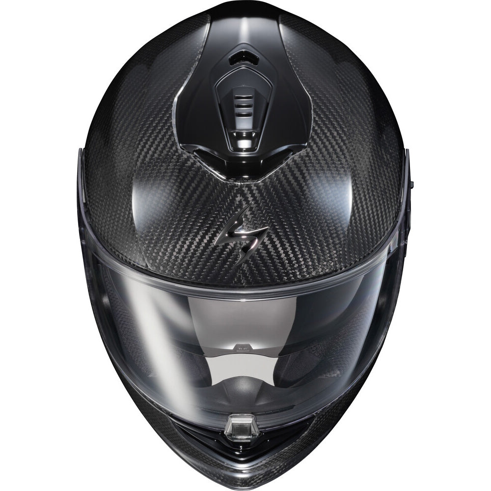A black carbon fiber full-face motorcycle helmet with a clear visor, shown from a front-facing perspective on a solid white background.