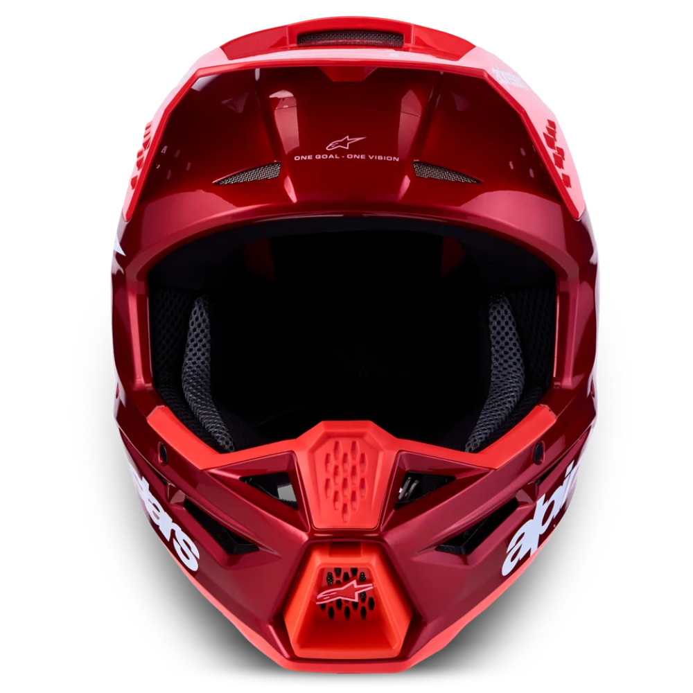 A red Alpinestars full-face motocross helmet shown from a front-facing perspective against a solid white background.