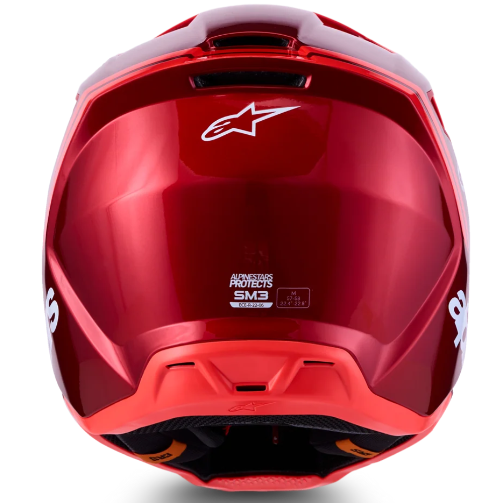 A glossy red Alpinestars full-face motorcycle helmet shown from the rear, featuring a white Alpinestars logo on the back and a clear visor, set against a clean white background with a soft shadow.