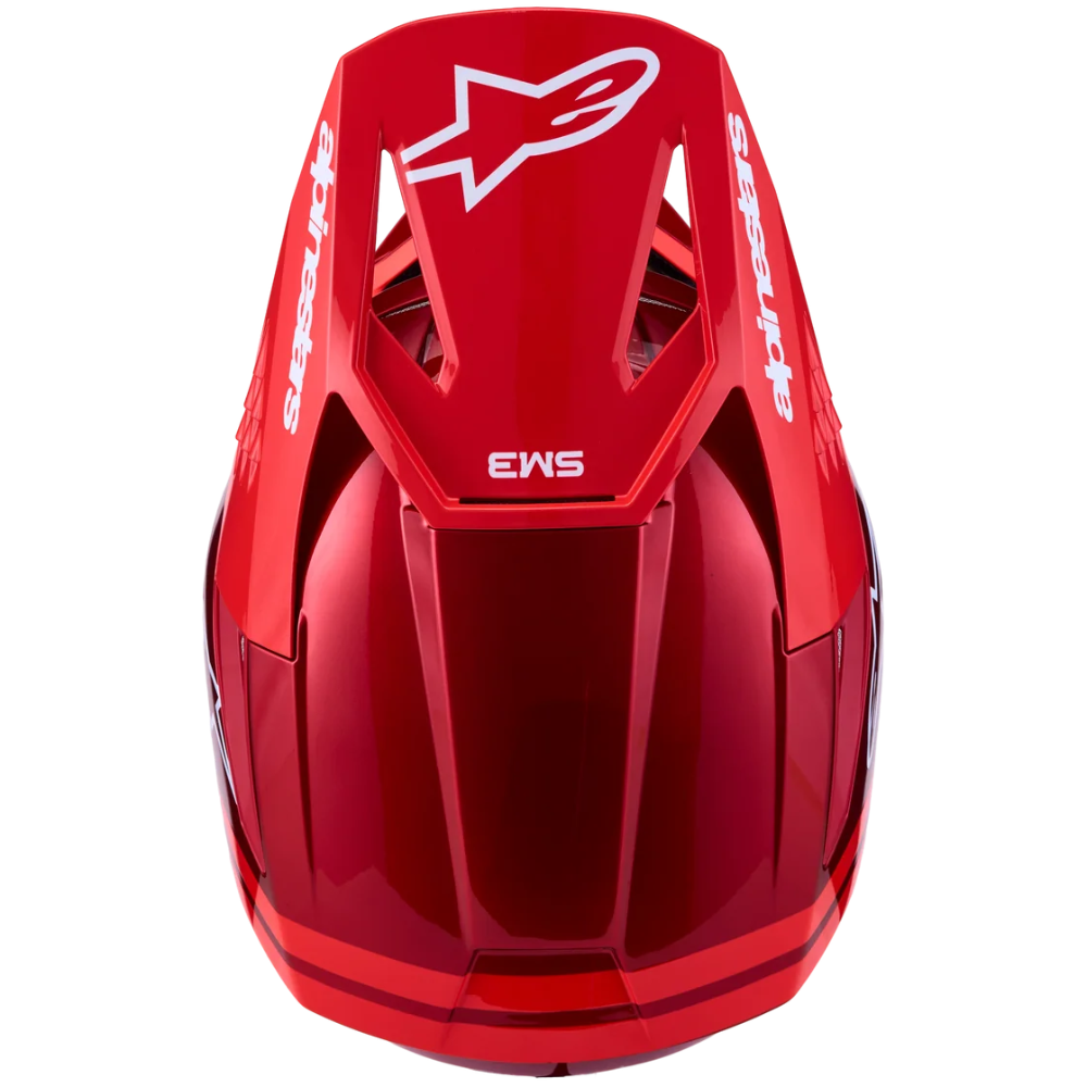 A glossy red Alpinestars EWS mountain bike helmet shown from the rear top view on a solid white background.