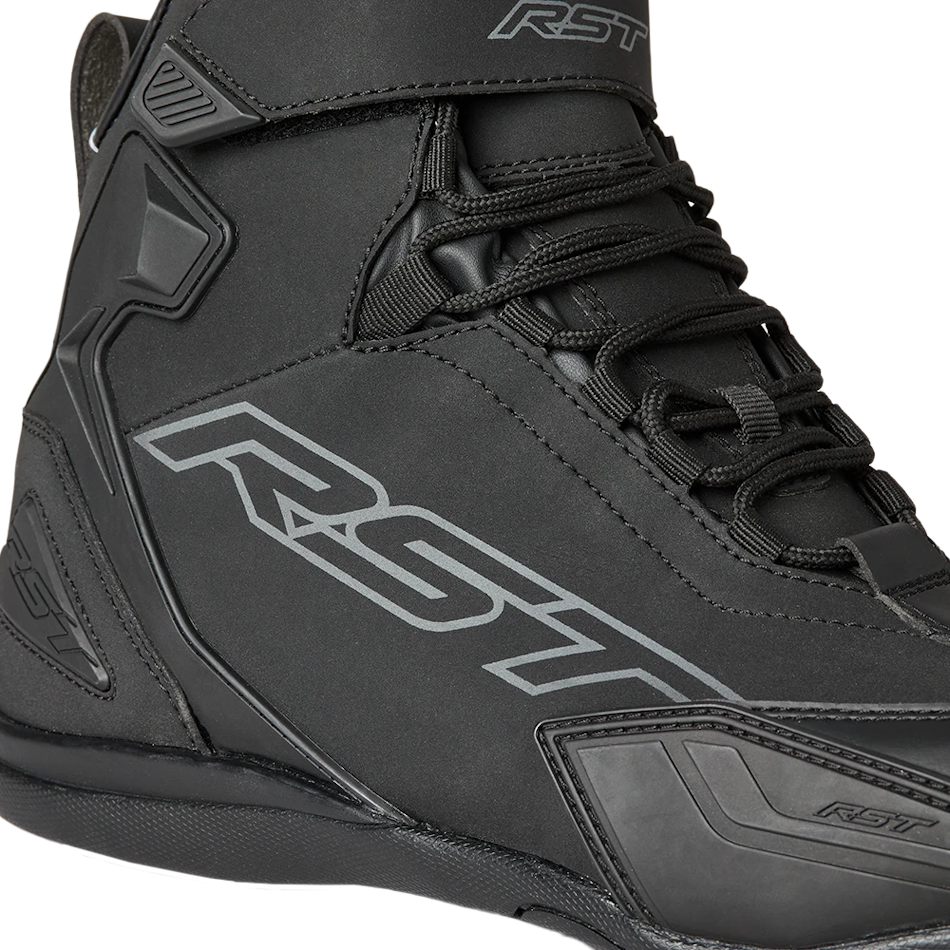Black high-top boot with RST branding on a white background