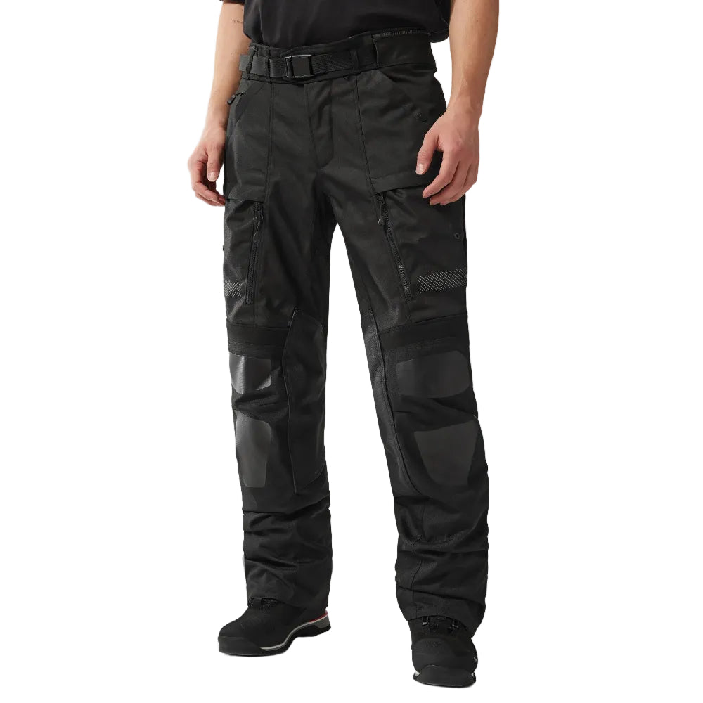 Person wearing black tactical pants on a white background