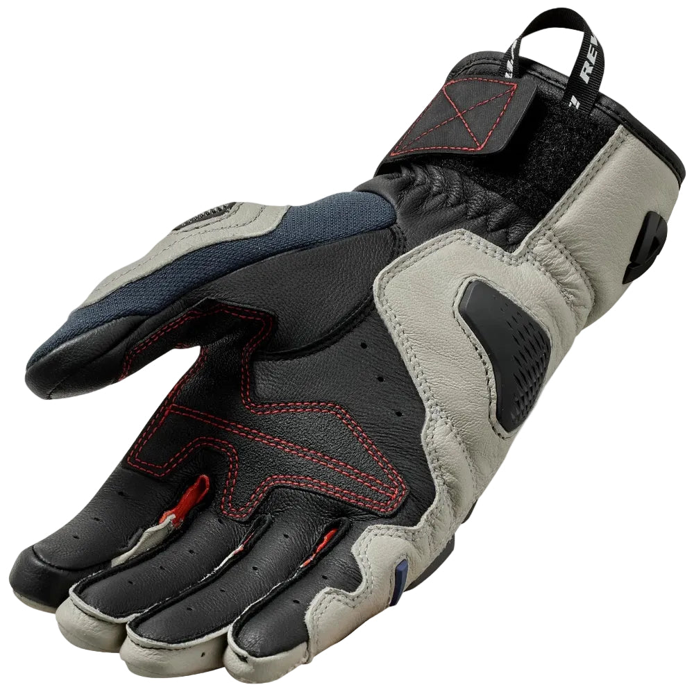 Pair of black and gray gloves with red accents on a light gray background