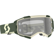 Scott motocross goggles in olive green and cream, featuring a clear shield lens and an adjustable elastic strap with a cream logo.