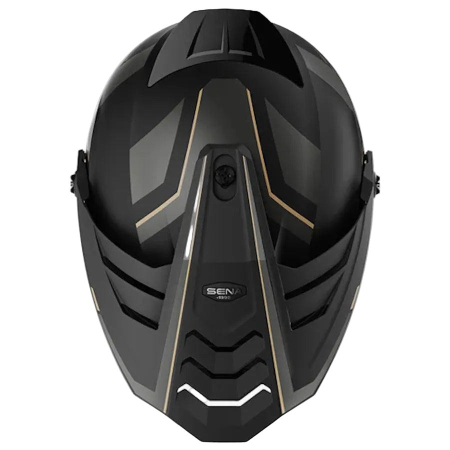 A black full-face motorcycle helmet with matte and glossy panels, accented by gold geometric lines and a white graphic on the lower front, shown against a light gray background.