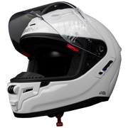A white full-face motorcycle helmet with a clear visor, shown in a three-quarter view against a solid white background. The brand 'SENA' is visible on the forehead area and the visor hinge.