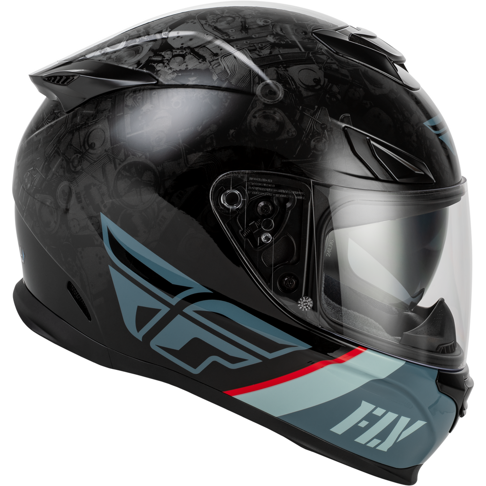 A Fly Racing full-face motorcycle helmet in black with a dark gray graphic pattern, light blue accents, and a red stripe, shown against a plain white background.