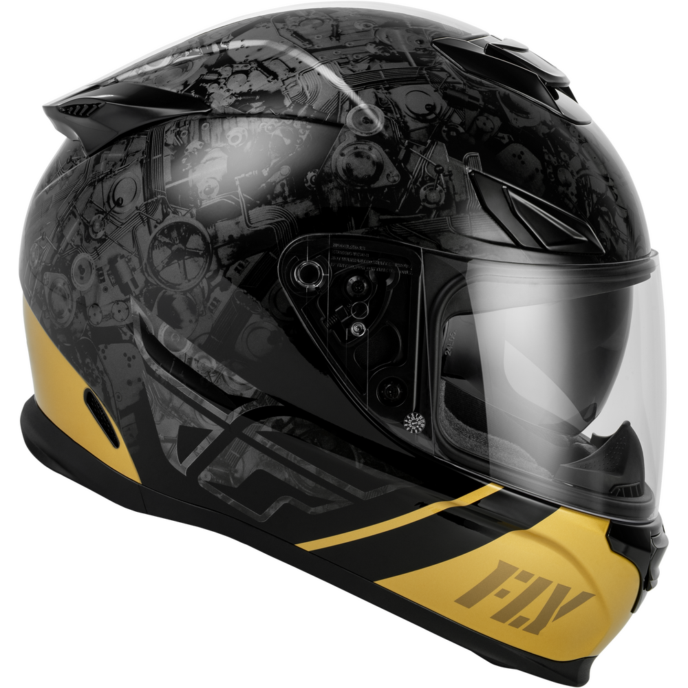 A full-face motorcycle helmet in glossy black with a detailed gray graphic pattern and bright yellow accents on the lower sides and chin bar, featuring a clear visor and the 'FLY' brand logo.