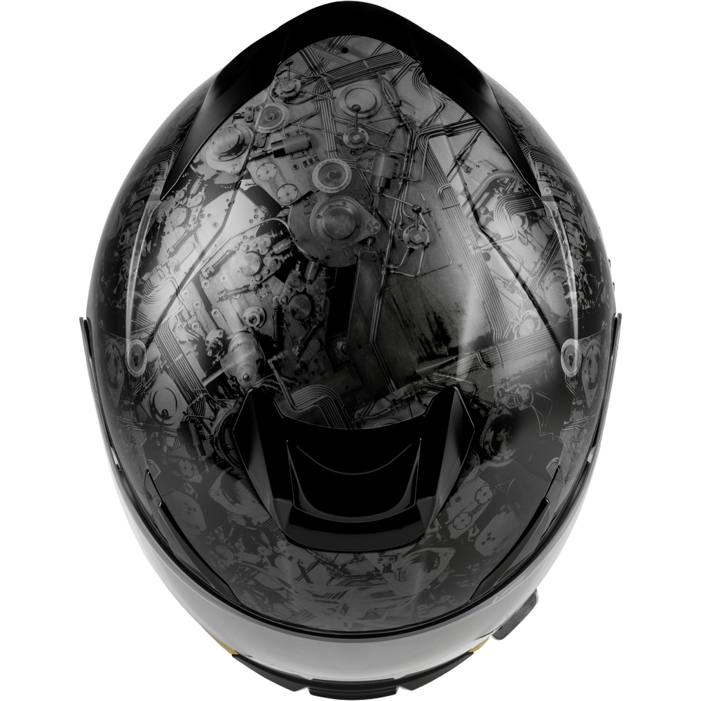A full-face motorcycle helmet shown from the front, featuring a glossy black visor with a detailed grayscale industrial engine or mechanical gear graphic printed across it.