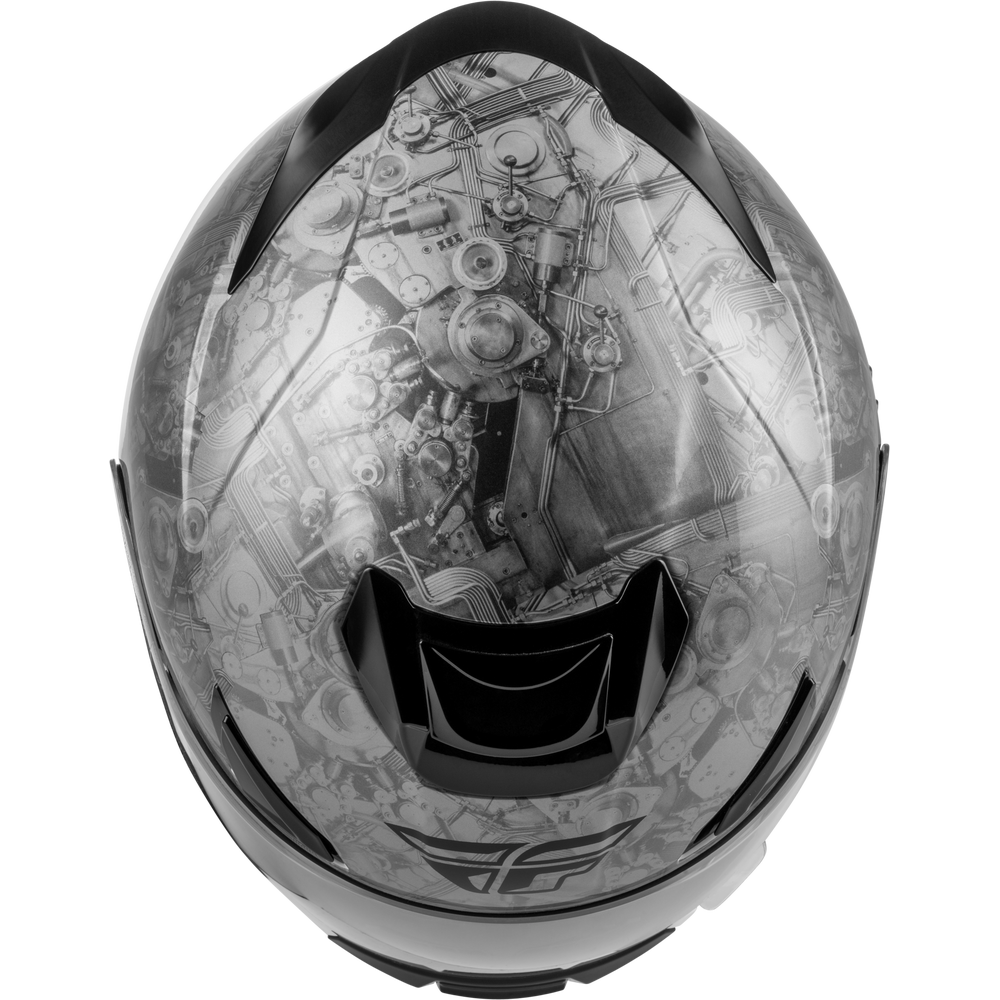 A full-face motorcycle helmet with a detailed black and white industrial engine graphic printed across the visor, shown against a plain white background.