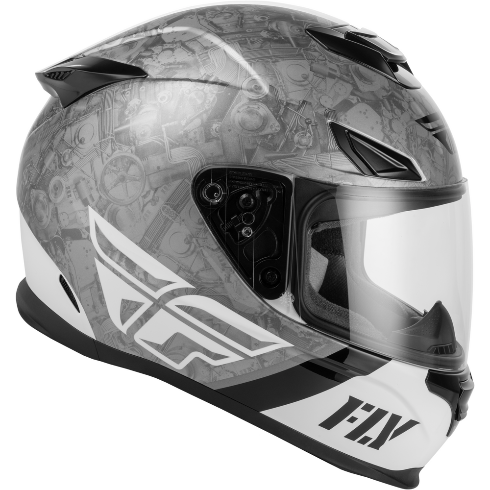 A full-face motorcycle helmet with a gray and white mechanical gear pattern, featuring a clear visor and the 'FLY' brand logo on the chin bar.