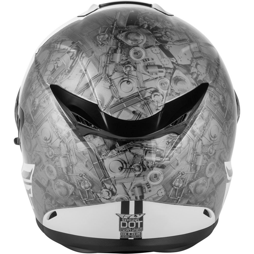 A full-face motorcycle helmet featuring a detailed black and white mechanical engine or gear pattern on the shell, with a black visor and a white lower chin bar.