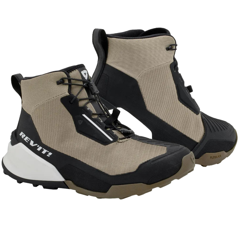 Pair of beige and black high-top shoes on a light gray background