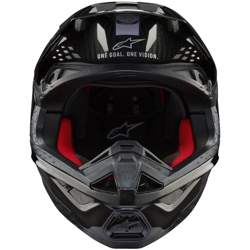 Black motorcycle helmet with red interior on a white background