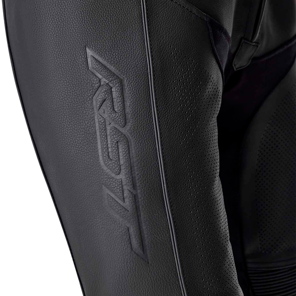 Close-up of black textured leather motorcycle pants showing the embossed R3F brand logo on the thigh.