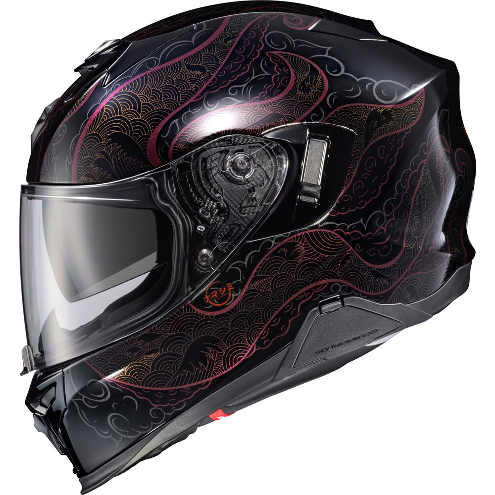 A full-face motorcycle helmet with a glossy black base and an intricate Japanese wave pattern in metallic gold and pink, featuring a clear visor.