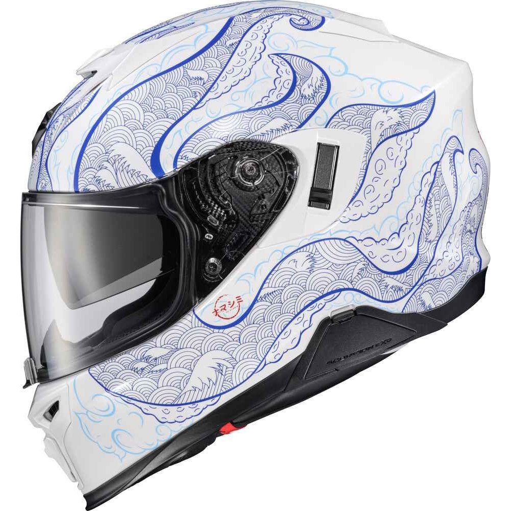 A white full-face motorcycle helmet with a blue and light gray wave pattern, featuring a clear visor and black chin bar.