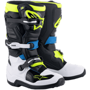 Pair of motocross boots with black, white, and neon yellow design on a white background