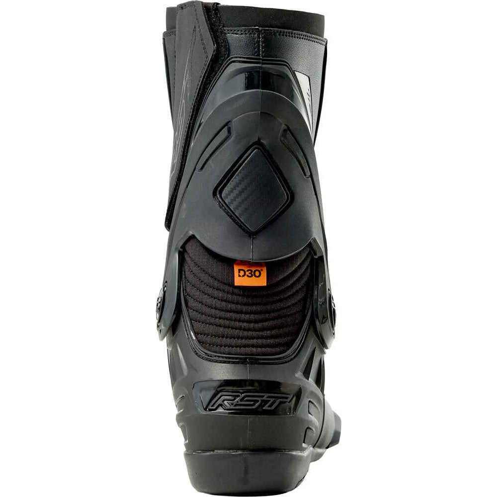 A black RST motorcycle boot shown from the rear three-quarter view, featuring a small orange D30 label on the heel area, set against a plain white background.