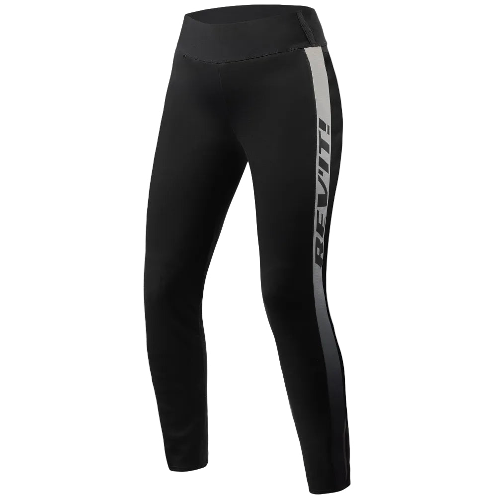 Black athletic leggings with a vertical gray side stripe featuring the brand name 'REVIT!' in white, shown on a light beige background.