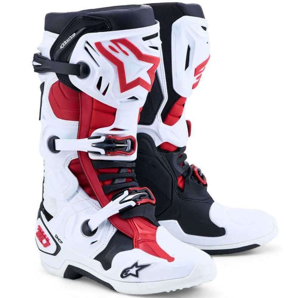 Black, red, and white motocross boots with visible branding on a white background