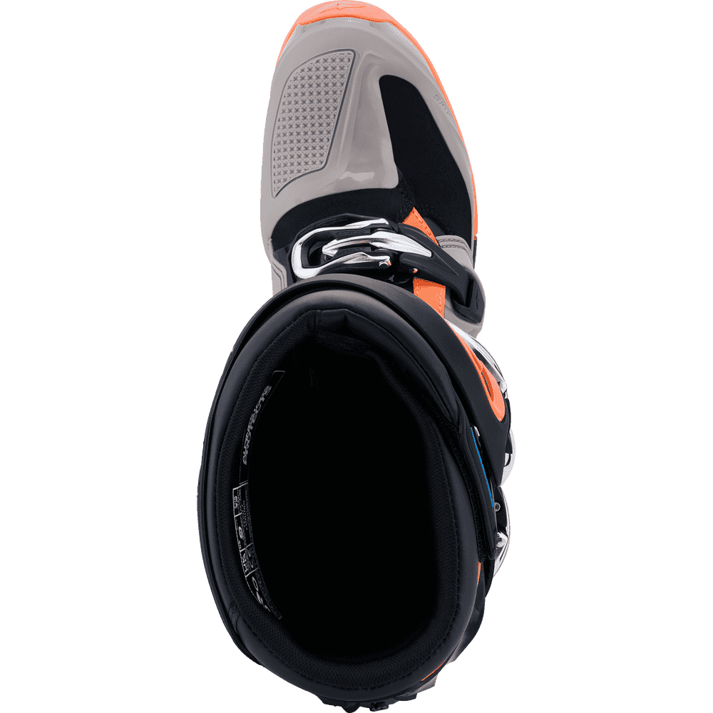 Alpinestars motocross boot in black, gray, and bright orange, shown from the top on a white background.