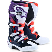 A pair of Alpinestars motocross boots in a colorway of navy blue, white, purple, and orange, shown on a clean white background.
