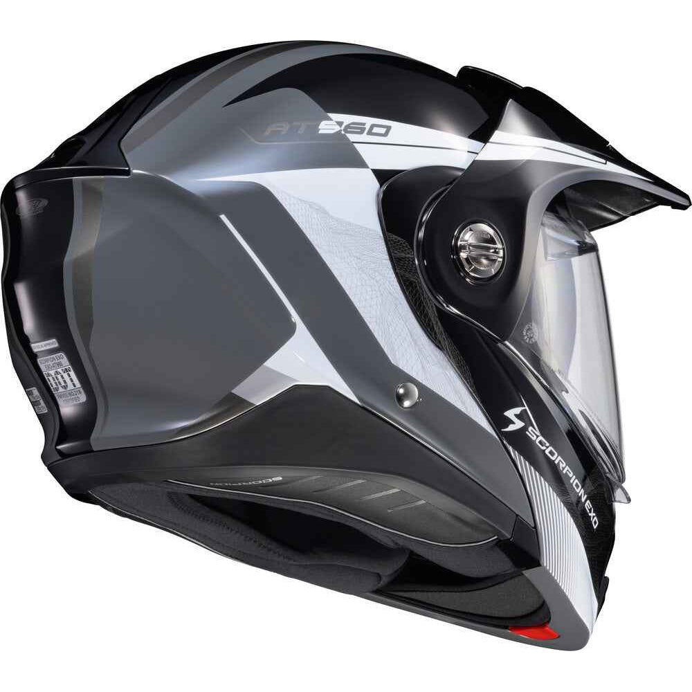 A full-face motorcycle helmet in glossy black and white with a clear visor, shown from a three-quarters angle on a white background.