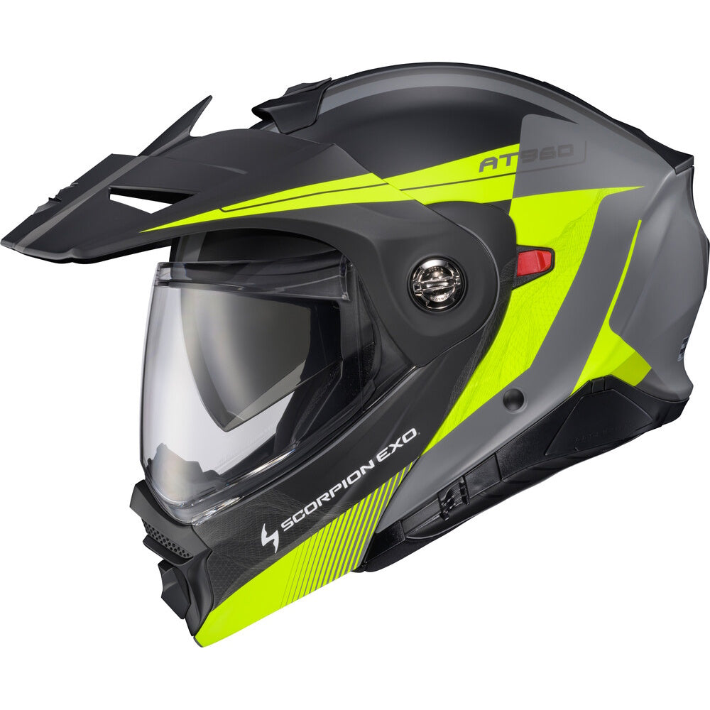 A Scorpion EXO AT960 full-face motorcycle helmet in matte black and neon yellow-green, featuring a clear visor and an adjustable ventilated brow strap, shown against a plain white background.