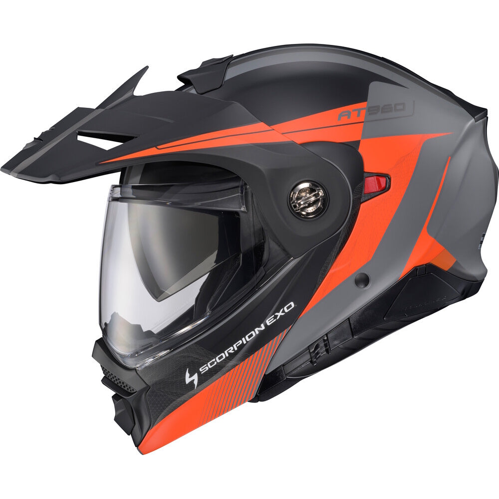 A Scorpion EXO AT960 full-face motorcycle helmet in matte black and bright orange, featuring a clear visor and a visible side ventilation valve, set against a plain white background.