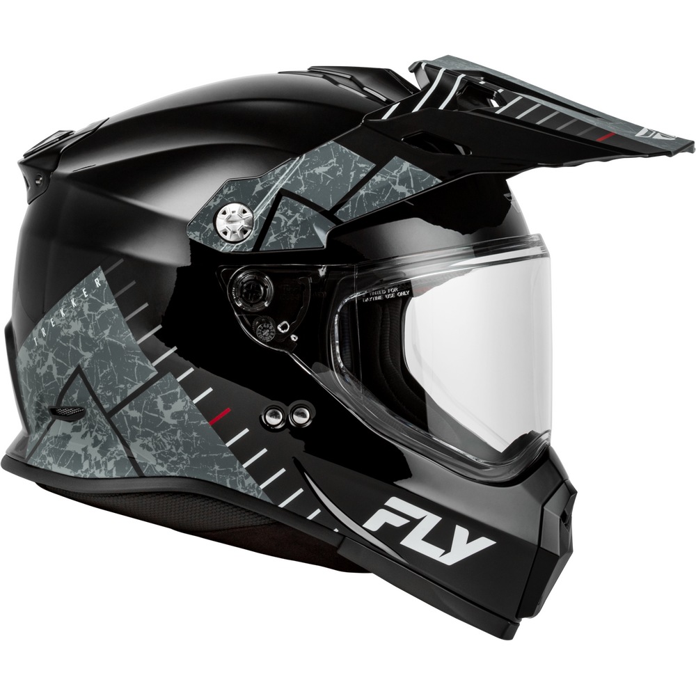 A black Dual Sport motorcycle helmet with a clear visor and an integrated pop-up windscreen, featuring gray and black geometric crackle patterns on the sides and a white FLY logo on the lower front.