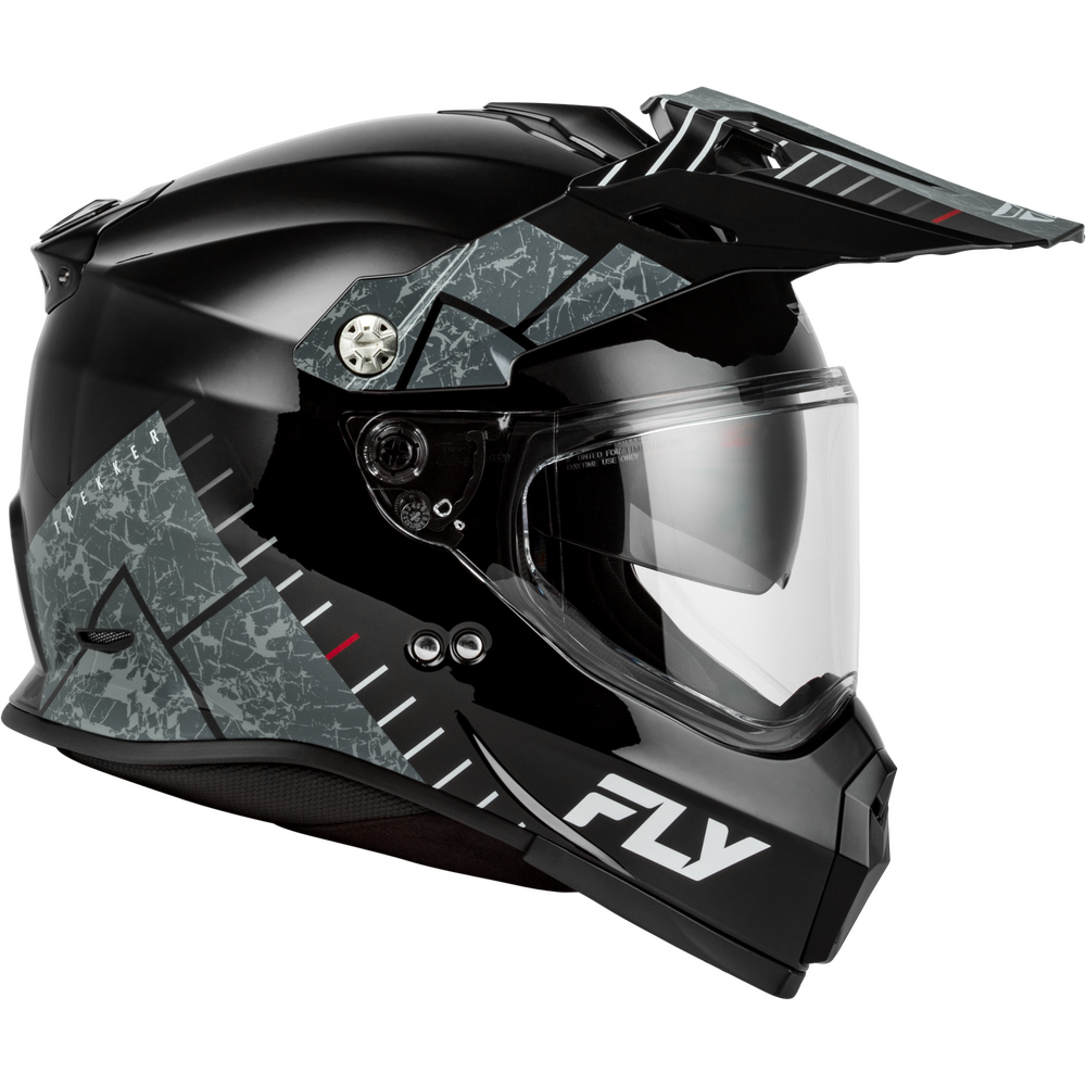 A black Dual Sport motorcycle helmet with a clear visor and an open top canopy, featuring gray and black geometric patterns on the sides and a white 'FLY' logo on the lower front.