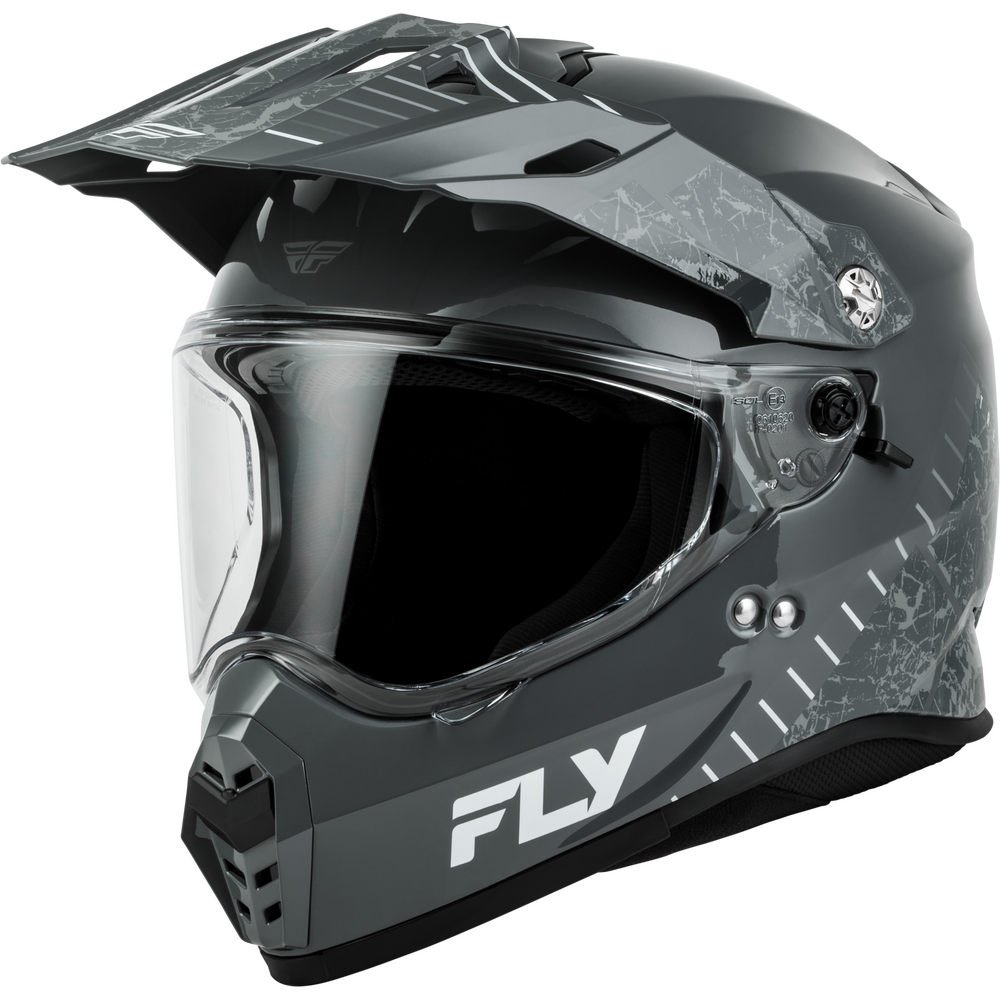A matte black Dual Sport motorcycle helmet with a dark gray and white abstract graphic pattern on the sides, a clear visor, and a white 'FLY' logo on the lower front.
