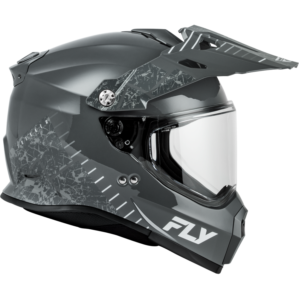 A dark gray Dual Sport motorcycle helmet with a cracked glass pattern on the side, a clear visor, and a white 'FLY' logo on the lower front, shown against a plain white background.