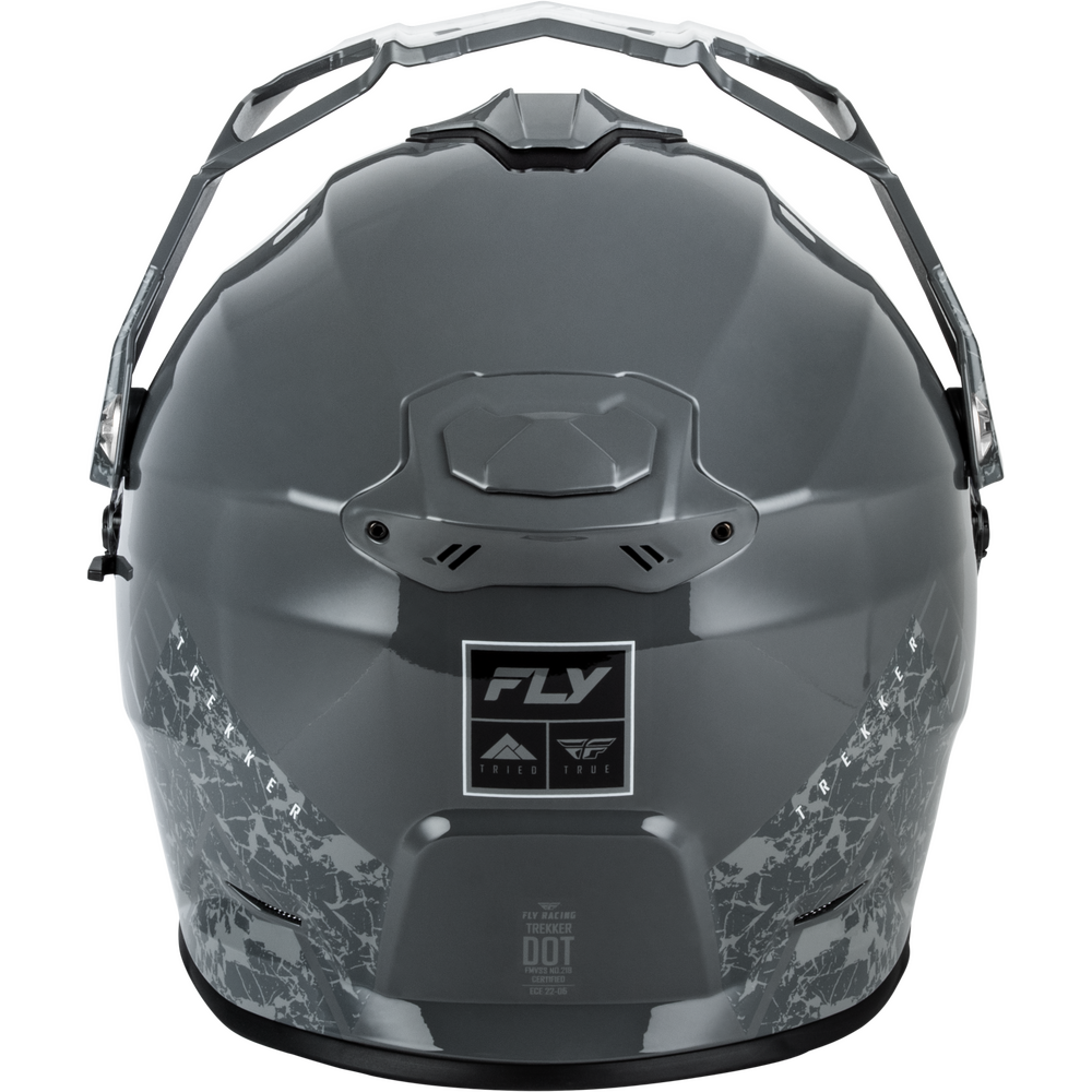 A dark gray Dual Sport motorcycle helmet with a glossy finish, featuring a black and white graphic pattern on the lower sides and a central 'FLY' brand patch.