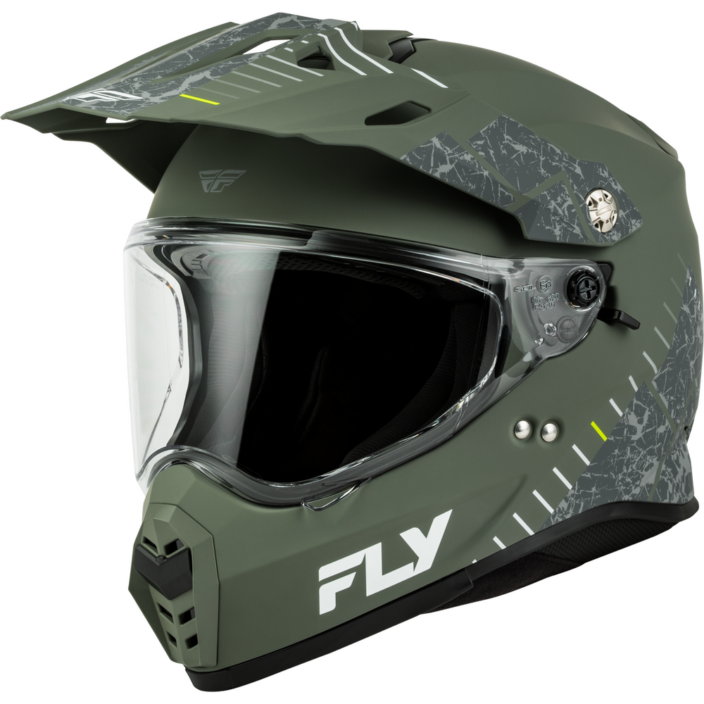 An olive green Dual Sport motorcycle helmet with a clear visor, featuring a white and gray camouflage pattern on the side panels and the white 'FLY' brand logo on the lower front.