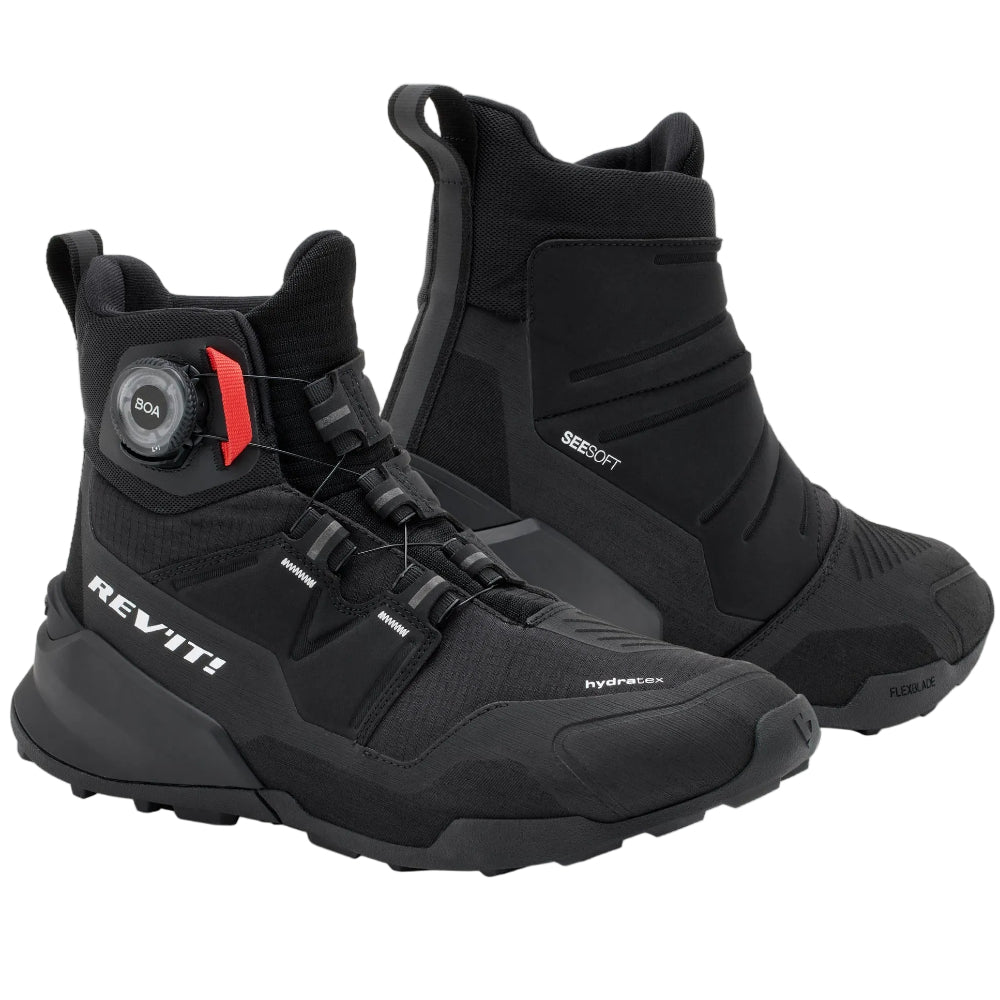 Black high-top sneakers with visible brand logo on a light gray background
