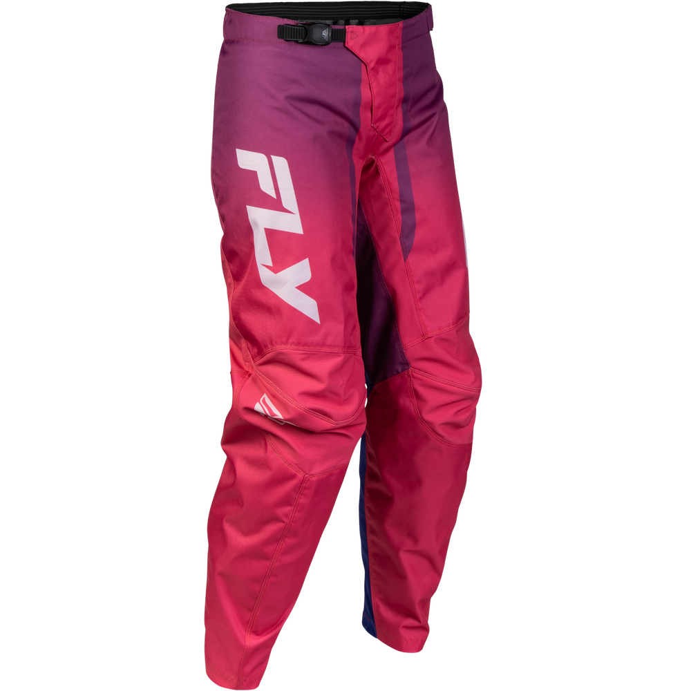 A pair of motocross pants in a magenta-to-purple gradient, featuring a large white 'FLY' logo on the left leg and a black waistband with a quick-release buckle.