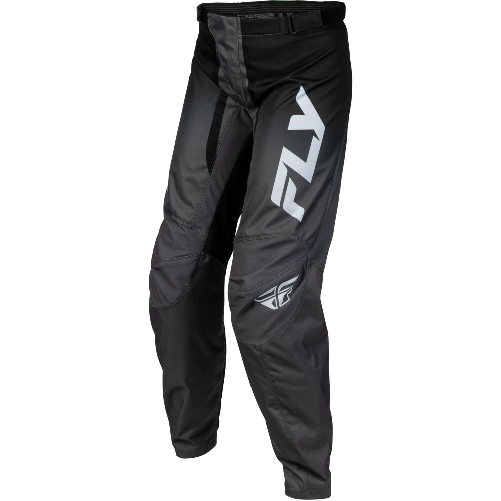 Black Fly motocross pants with a large white 'FLY' logo on the left thigh and a smaller matching logo near the lower left leg, shown on a plain white background.