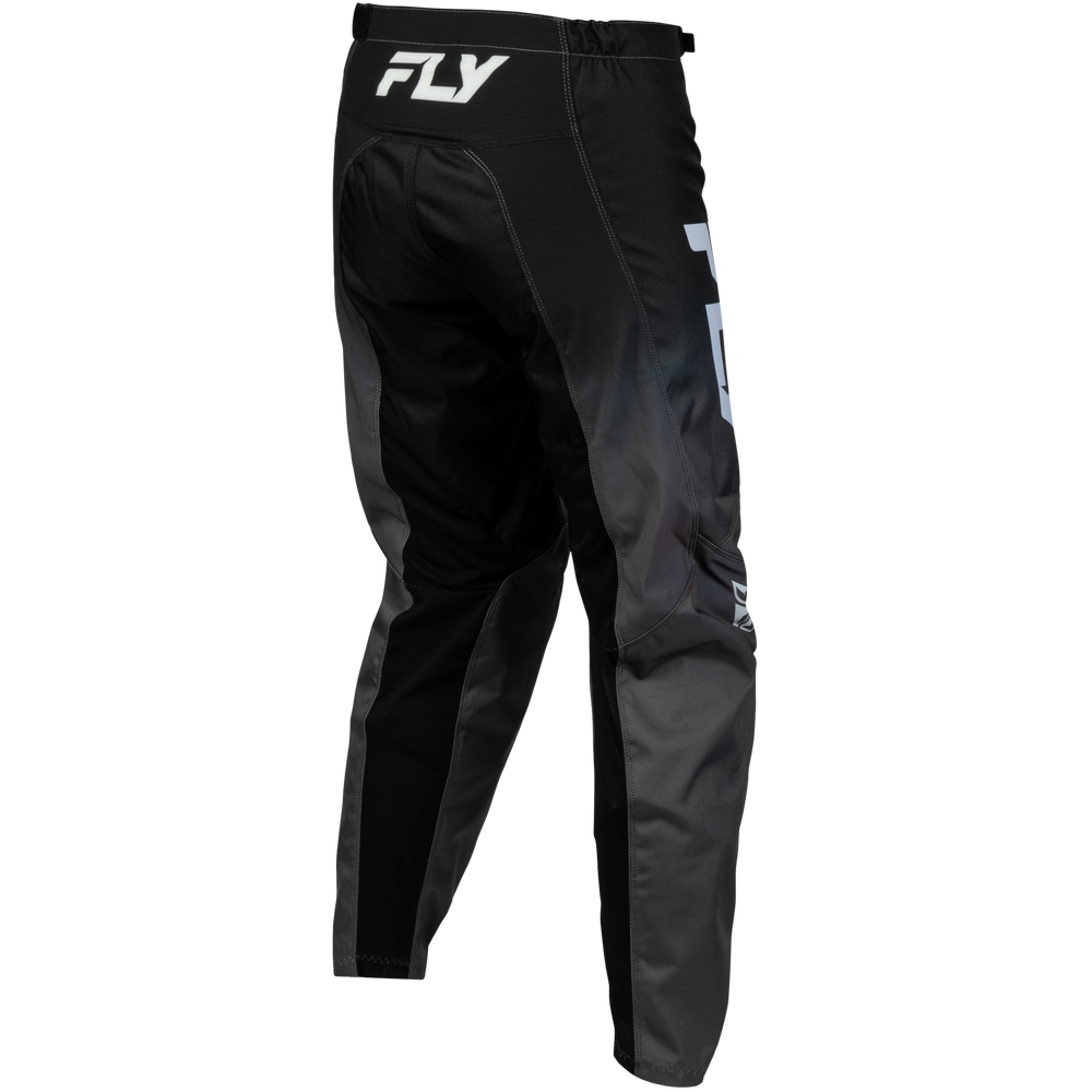 Black and dark gray motocross pants with white FLY branding on the waistband and leg, shown from a three-quarters angle on a white background.