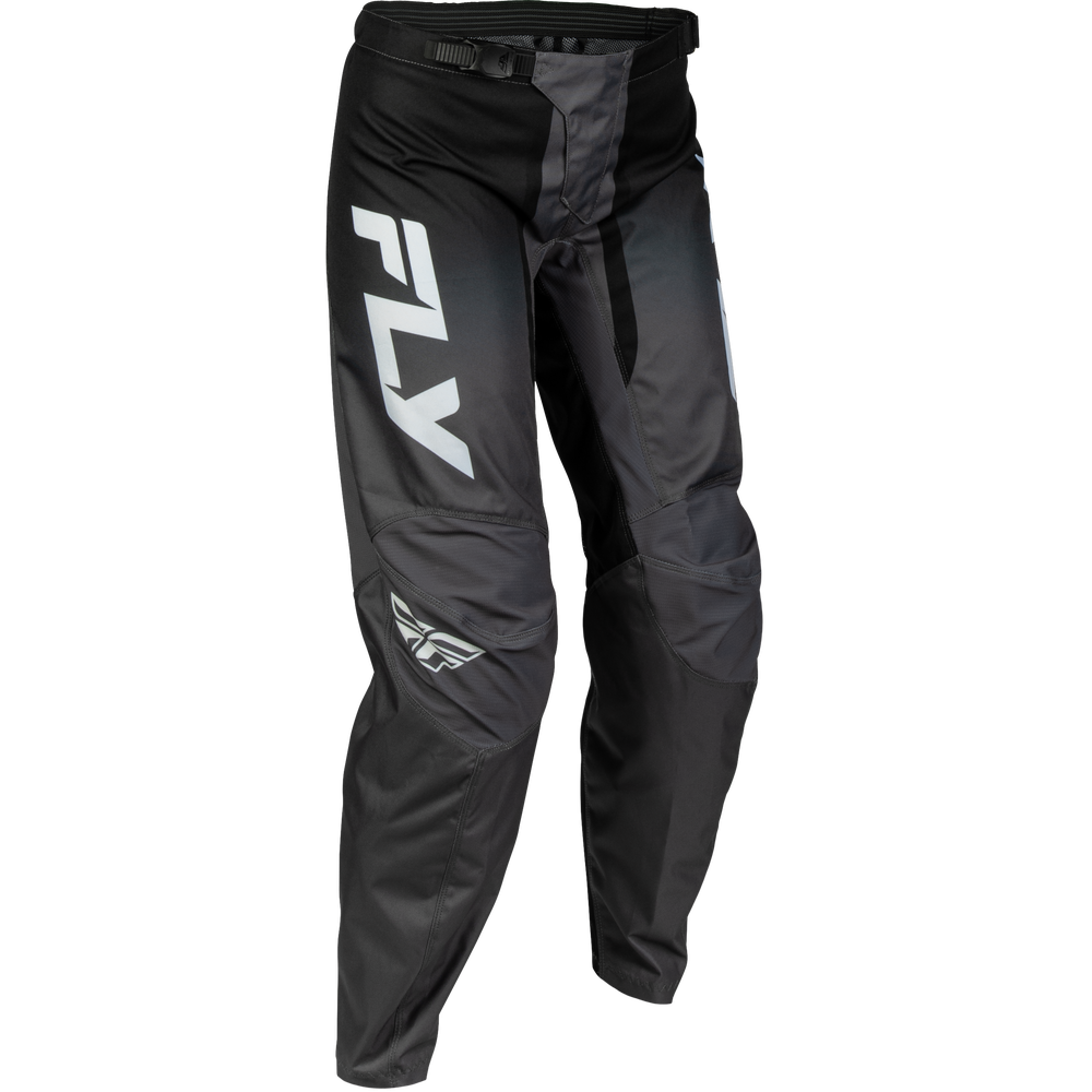 Black and dark gray motocross pants with a large white 'FLY' logo on the left thigh and a smaller matching logo near the lower leg, shown on a plain white background.