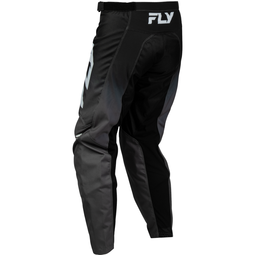 Black and dark gray motocross pants with a white FLY logo on the waistband, shown from a side-rear angle on a white background.