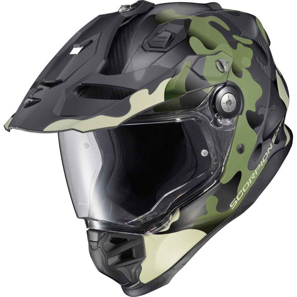 Camouflage motorcycle helmet with clear visor on a white background