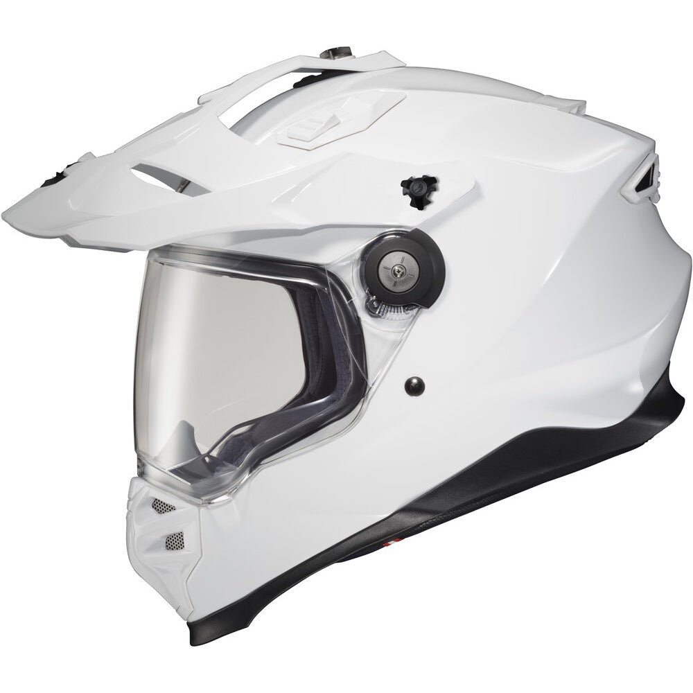 A white full-face Dual Sport  motorcycle helmet with a clear visor and black trim, shown from a three-quarters angle on a white background.