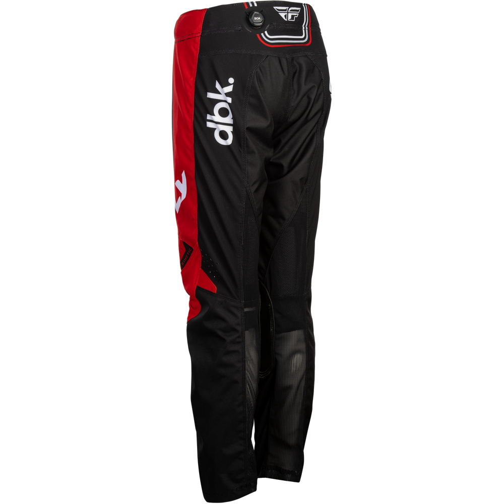 Black and red motocross pants with a white 'dbk' logo on the side, shown against a plain white background.