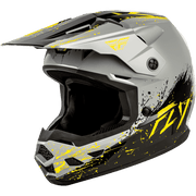 A Fly Racing full-face motocross helmet in matte gray with black and neon yellow graphic splatter details, shown from a three-quarters front angle on a white background.
