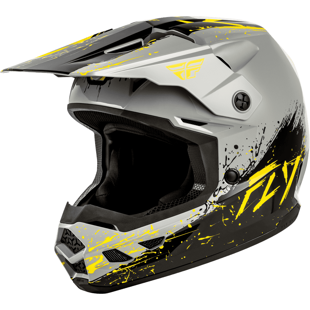 A Fly Racing full-face motocross helmet in matte gray with black and neon yellow graphic splatter details, shown from a three-quarters front angle on a white background.