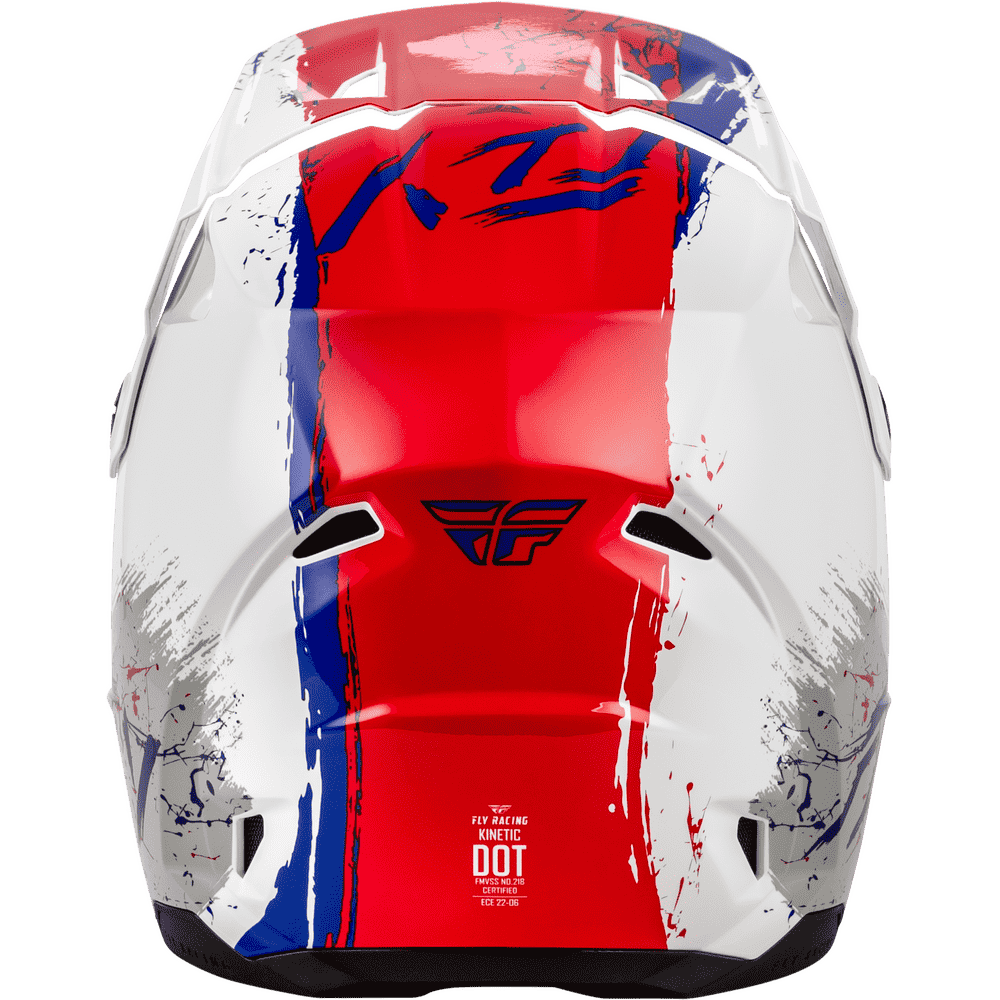 A close-up rear view of a full-face motocross helmet featuring a bold red, white, and blue graphic design with a vertical stripe pattern and distressed paint splatters. The Fly Racing logo is visible on the back.